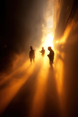 Silhouette of construction workers in a foundry shop creating dramatic effects with dust and light
