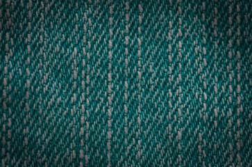 Close-Up View of Thick Slubbed Yarn Interwoven Pattern in Deep Teal