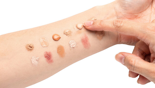 Closeup of hand applying a cosmetics patch test on inner forearm against a white background highlighting skin reaction for safe makeup use at home.