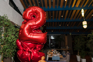 Coziness and style. Modern event design. Balloons decoration for a child's birthday party dinner.