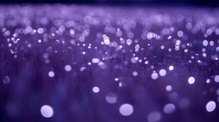 Abstract background of shimmering purple bokeh lights creating a magical and ethereal atmosphere of glowing orbs