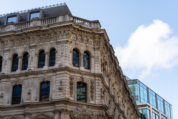 Obraz premium Ornate historic building with modern glass contrast