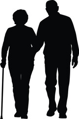 Elderly couple walking together in silhouette