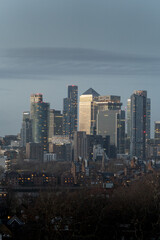 City skyline at dusk with glowing buildings