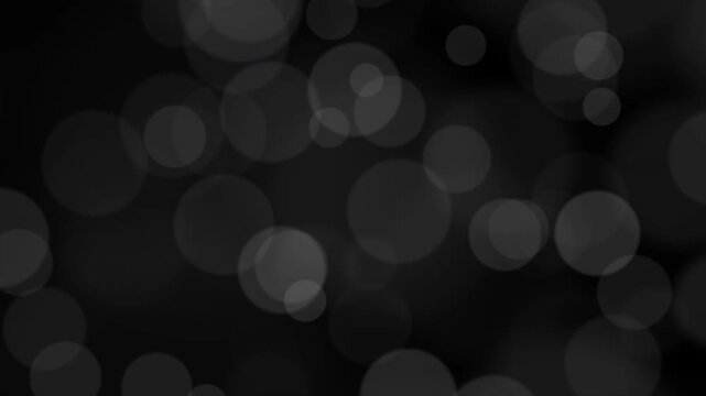 Elegant Black and White Abstract Bokeh Particles Motion Graphics Background.Soft monochrome bokeh background featuring floating light circles, ideal for professional video overlays 