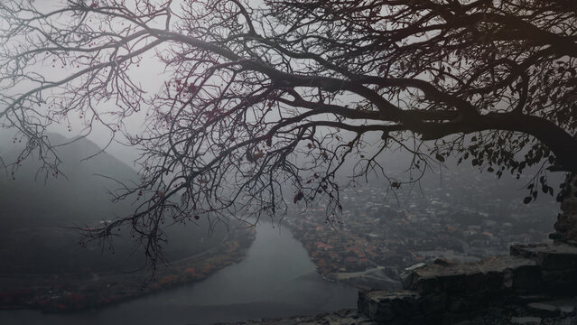View on Mtskheta drom Jvari monastery in the fog, Georgia