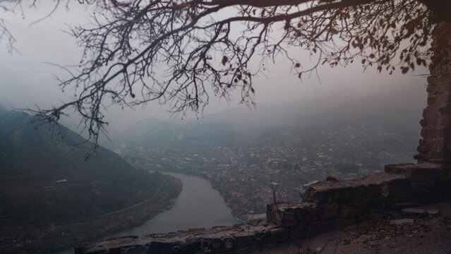 View on Mtskheta drom Jvari monastery in the fog, Georgia