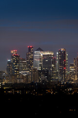 Night city skyline with illuminated skyscrapers