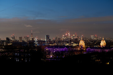 City skyline at night with illuminated buildings