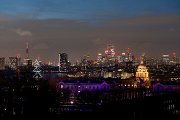 Skyline with holiday lights and evening glow