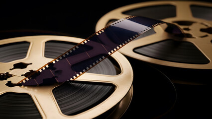 Vintage movie film reels on black background | Retro celluloid film strip and cinematography equipment close-up | Classic Hollywood golden era cinema production concept