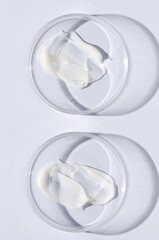 Moisturizing cosmetic skin cream in a Petri dish.