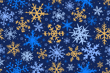 Seamless winter pattern with elegant snowflakes on a dark blue background. Blue, light blue and gold snowflakes are hand drawn. Perfect for Christmas designs, wrapping paper, textiles, wallpapers 