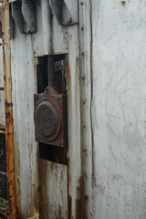Close-up view of rusted metal machinery with visible wear and tear