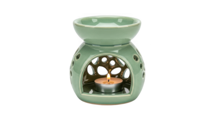 Green ceramic oil burner with lit candle inside isolated on transparent background