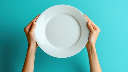 Hands Holding Empty White Plate Against Bright Blue Background for Minimalistic Food Presentation or Culinary Concepts