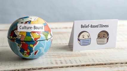 Culture-Bound Syndromes Globe and Masks on Wooden Surface