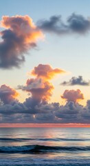 Ocean sunset with fluffy clouds and beautiful sky.