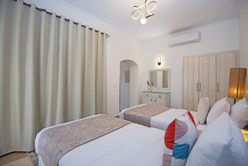 Interior design of twin bedroom in luxury house