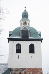 The bell tower of Porvoo Cathedral Finland in a snow shower