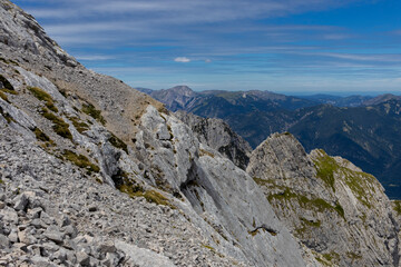 Fototapeta premium Alpspitze and Zugspitze mountains in Germany and Austria, Garmisch-Partenkirchen town in Bavaria region. Highest mountain of Germany, via ferrata on Alpshpitze beautiful mountain alpine landscape