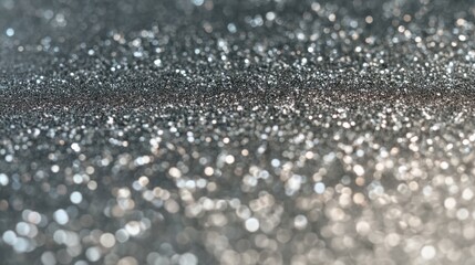 An array of small metallic particles scattered uniformly, highly reflective spherical shapes with varying sizes,