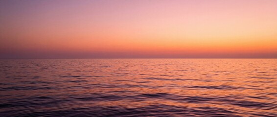 Obraz premium A serene seascape under a gradient sunset, the horizon kissed by the warm hues of twilight. Capturing tranquility and natural beauty.