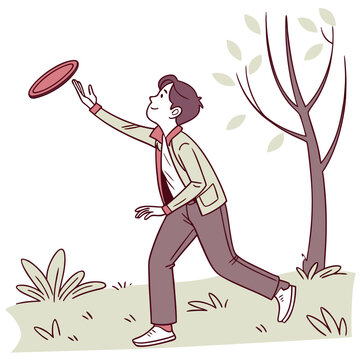 Young man catching frisbee in a park