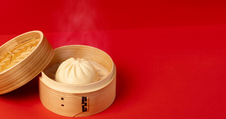 Chinese steamed bun in a bamboo steamer. steamer basket, chinese steamed bun. meat bun, pork bun, Bao, etc. 竹せいろに入った中華まん。せいろ、中華まん、肉まん、豚まん、包子など。	