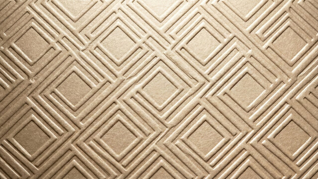 Champagne colored paper with blind embossed geometric pattern texture