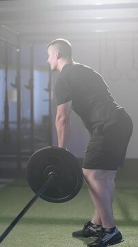 Fitness man train Landmine single leg romunian dead lift Weightlifting in gym