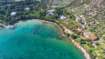 Aerial view of colorful sea water and beach houses in Crete, Greece
