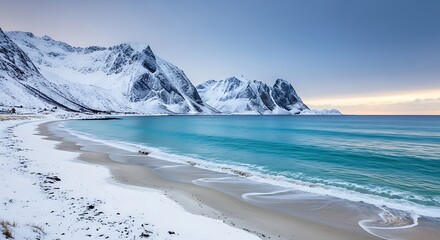 Snowy Beach Landscape with Mountains and Turquoise Water.