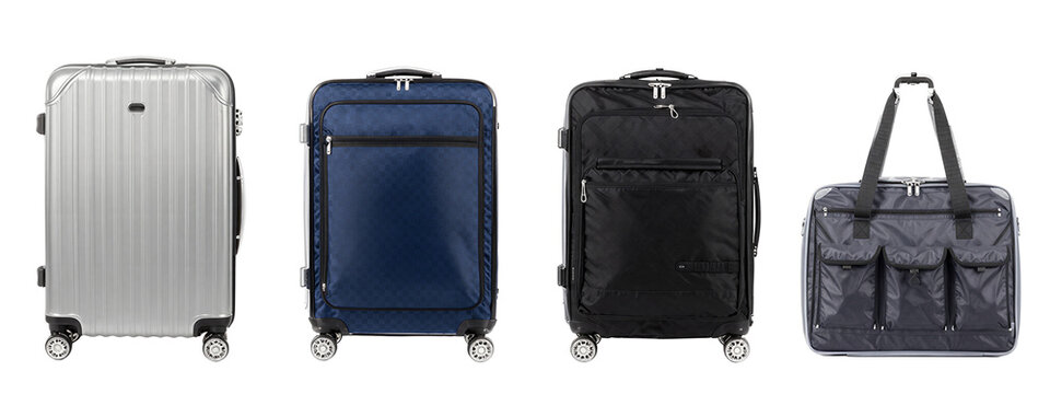 Photograph of four travel bags in a row: silver hard-shell suitcase, blue soft-shell suitcase, black soft-shell suitcase, and dark gray duffel bag with straps, all with wheels and zippers.