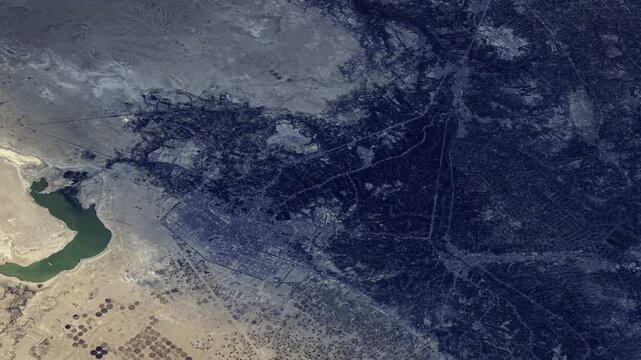 Satellite view of Karbala, Iraq, night to day time lapse aerial footage from space based on NASA imagery
