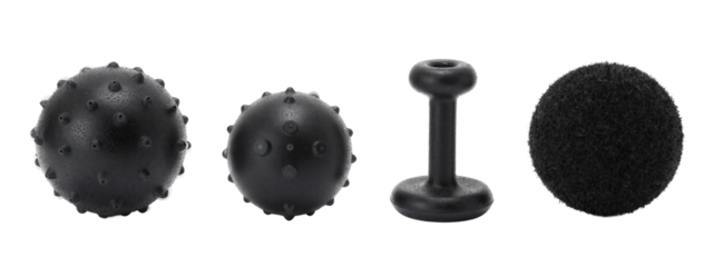 Four black textured objects in a row: two spherical with small bumps, one cylindrical with a flat base, one round and fluffy.