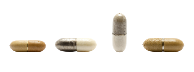 Photograph of four capsules, each with different textures and colors: brown and beige on the left, silver and white in the center, silver and beige on the right.