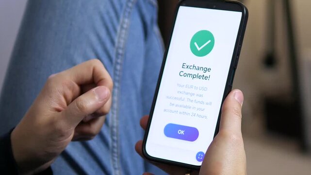A swift and successful international currency transaction. This closeup shows a clear notification confirming the completion of a foreign exchange trade, converting Euros to US Dollars