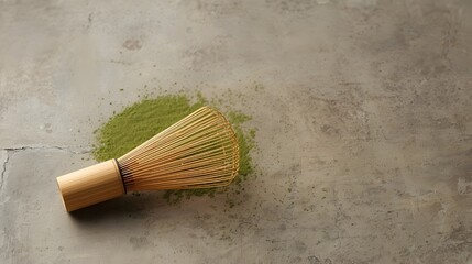 Traditional Japanese matcha whisk chasen and green tea set on minimalist stone background