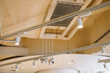 Modern Cafe Ceiling with Ventilation and Security Cameras