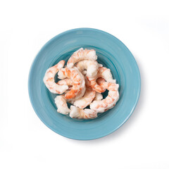 Top view of frozen prawn tails arranged on a light blue plate, showcasing raw seafood texture and freshness. Clean composition ideal for food, fishing, frozen products concepts.