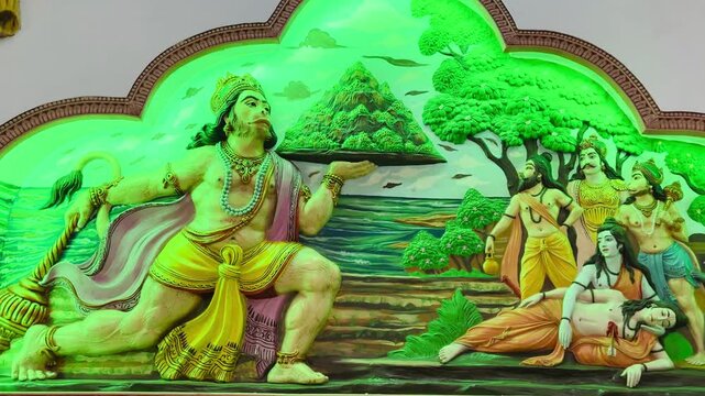 Lord Hanuman carrying the Sanjeevani mountain while Lord Rama and Lakshmana rest nearby, illustrating supreme devotion, strength, and selfless service.