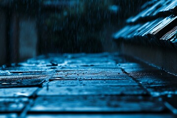 Rain-soaked tiles under a dark, brooding sky, reflecting the melancholic hush of a rainy night with deep blue tones and blurred background.
