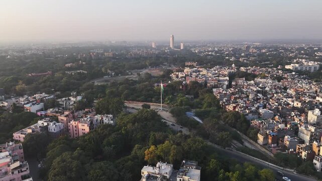 A powerful aerial moment as the Indian national flag towers over Delhi&rsquo;s near Modi Mill Flyover urban landscape, symbolising unity, resilience, and national pride at the heart of the city.