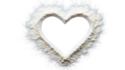 A delicate heart shape is formed from a powdery white substance against a stark black background