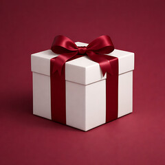 Beautifully wrapped white gift box with elegant red ribbon and bow