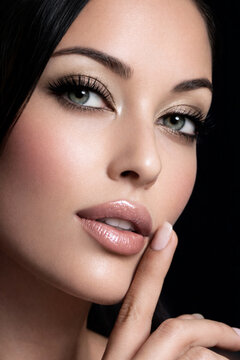 Glamorous beauty close up portrait of woman with flawless skin and makeup