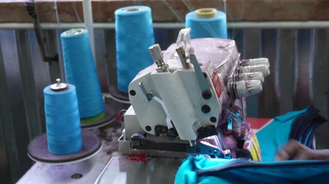 Overlock sewing machine in operation in a factory or workshop