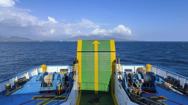 Bali, Indonesia - August 27, 2025: Car and passenger ferries cross the Bali Strait from Gilimanuk Harbor to Ketapang Harbor. View of the strait from the ferry deck. 4К