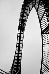 Stairway to heaven at the ruhr area. Black and white stairways. Isolated in front of cloudy sky.